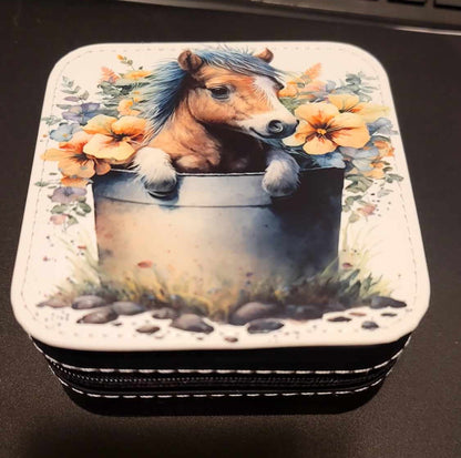 Pony in a water bucket